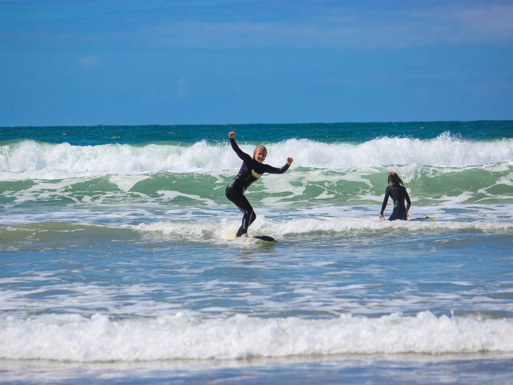 a surfer on a surfboard on a wave