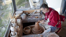 Ben at the wheel working on a vase