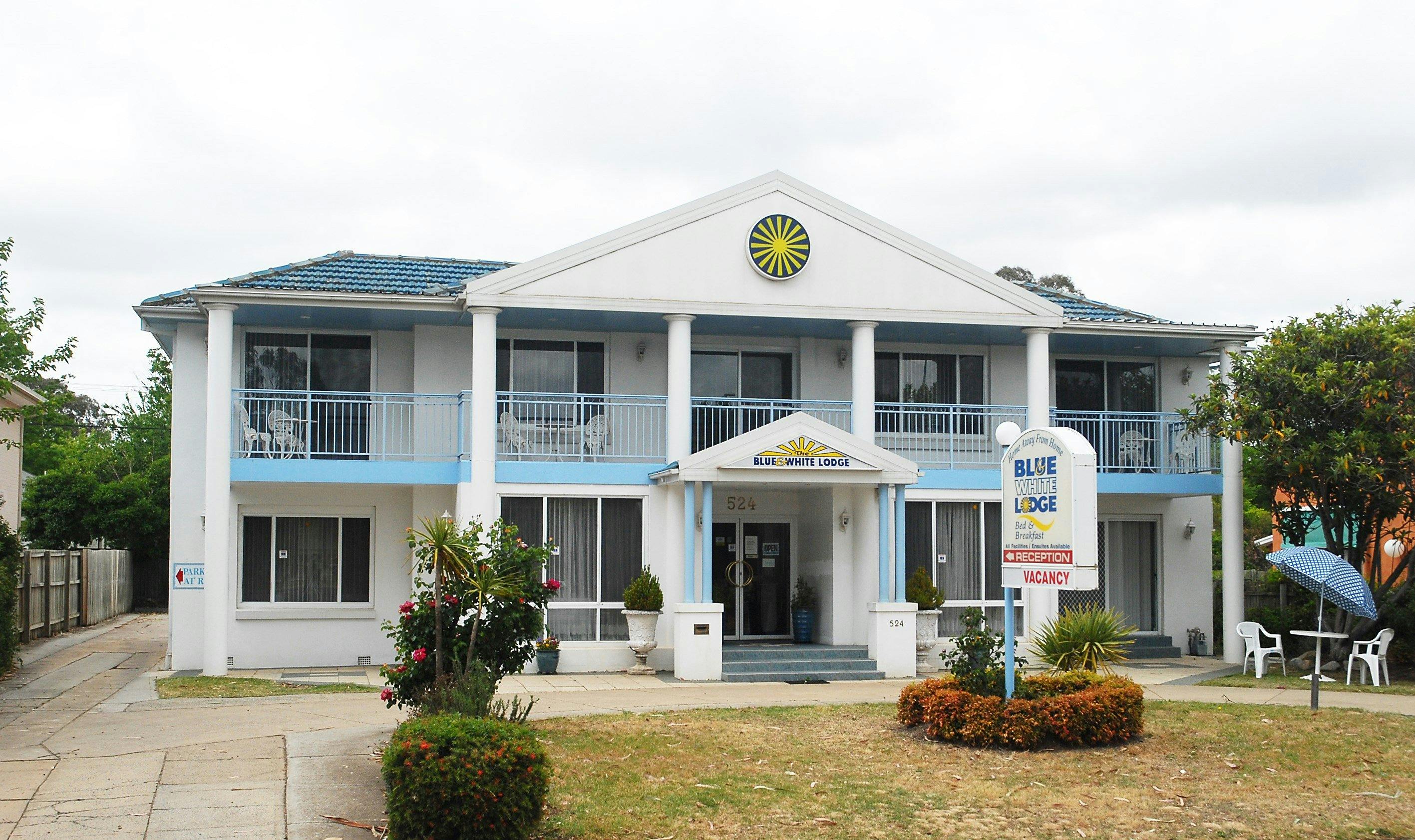 Blue and White Lodge exterior view from road