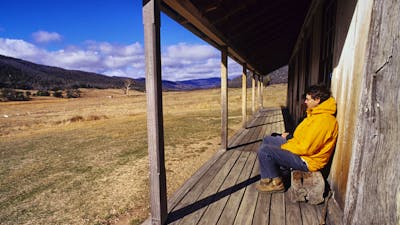 Hiker resting at Orroral Homestead