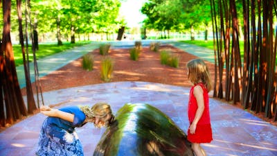 Children playing among the sculptures. Photo by Jinkyart