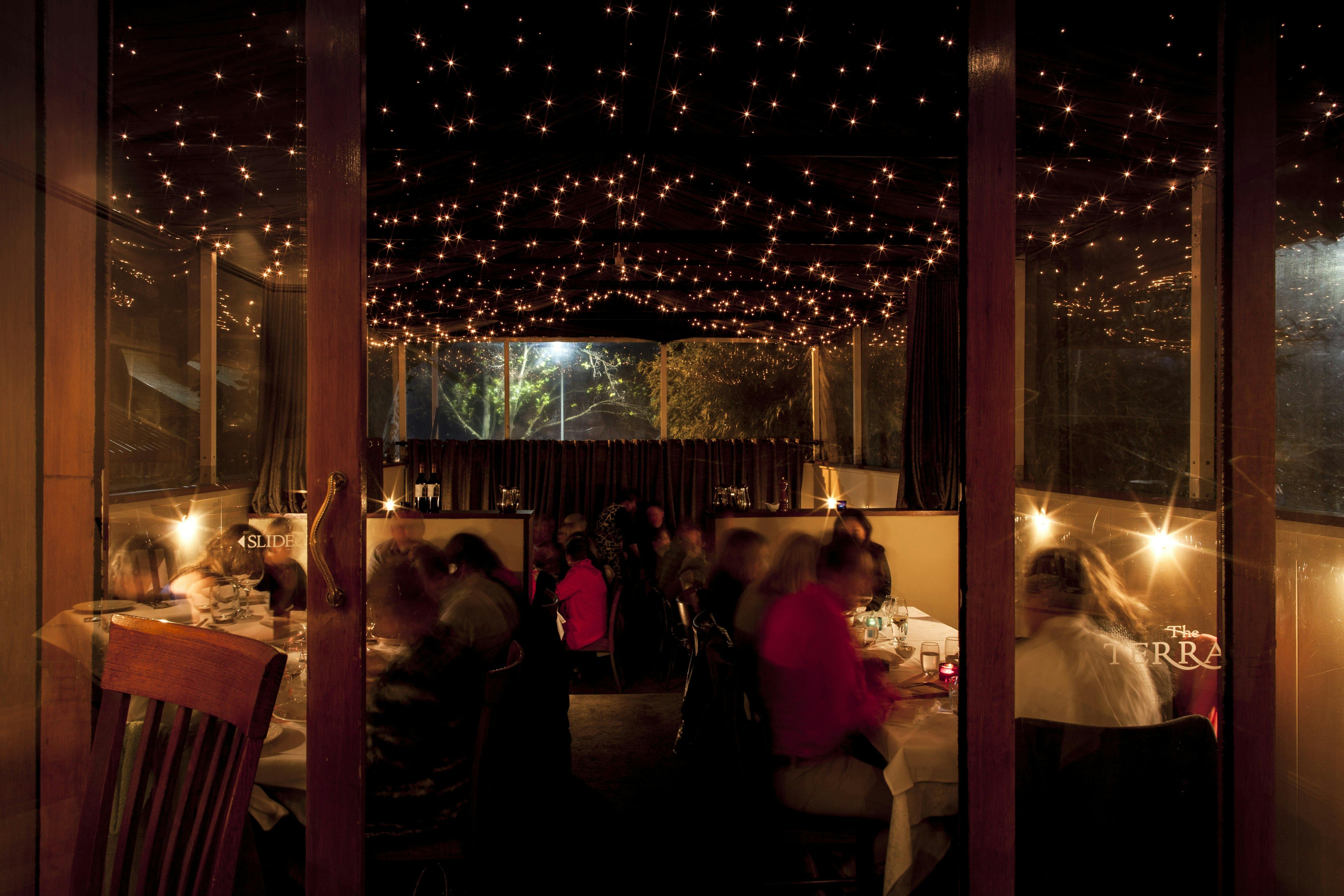 Romantic evening lighting over diners