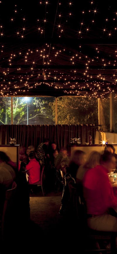 Romantic evening lighting over diners