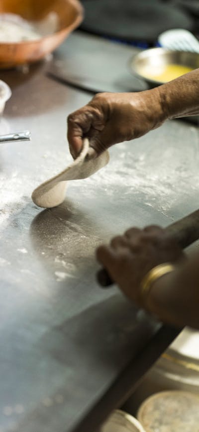 Chef rolling out dough