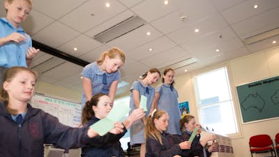 Students counting votes in a mock election