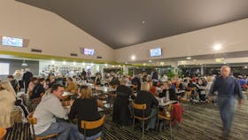 A busy bar area with lots of seating