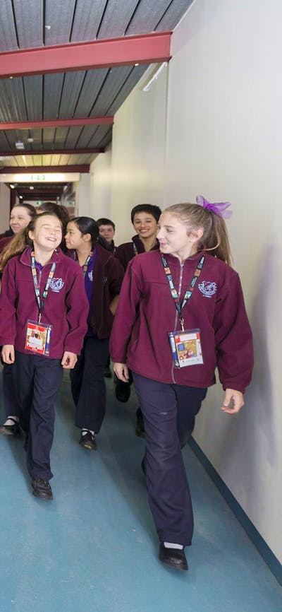 Tour group walking past the athletes training area