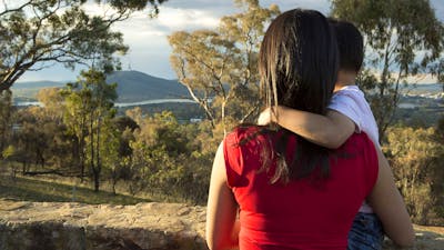 Mother and son looking towards Black Mountain and Telstra Tower