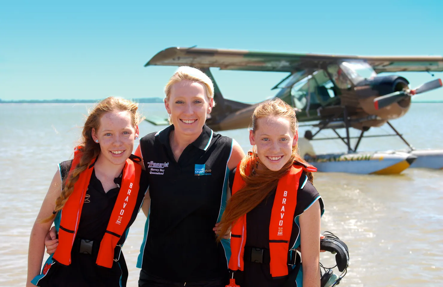 3 passengers smile after their flight