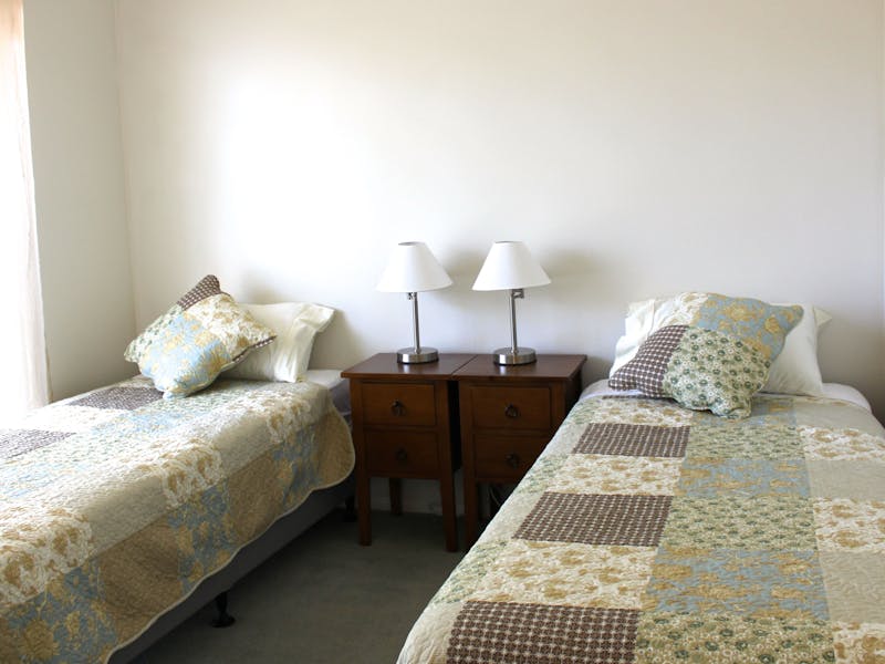 This light-filled room looks onto the leafy garden and captures the cooling Bay breezes.