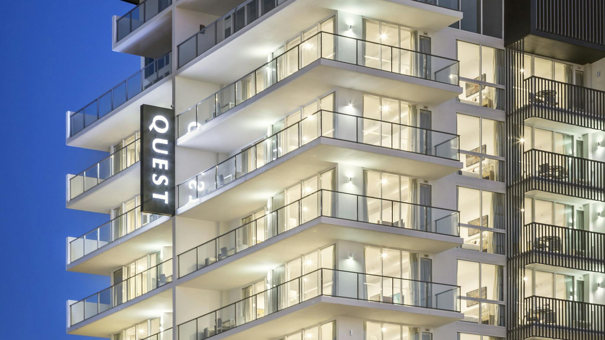 Modern 10 level hotel exterior with a welcoming entrance. Modern 10 level hotel exterior with a welcoming entrance.