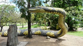 The Gudjuda Reference Group commissioned the large carpet snake sculpture Gubulla Munda Dreaming (2004), which was painted by aboriginal artists and stands on a sacred site, along with several plaques and a memorial stone, in Plantation Park, Ayr, North Queensland.