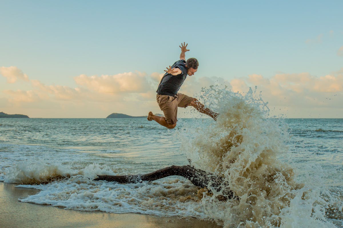 Jumping in the waves on Kewarra Beach