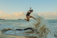 Jumping in the waves on Kewarra Beach