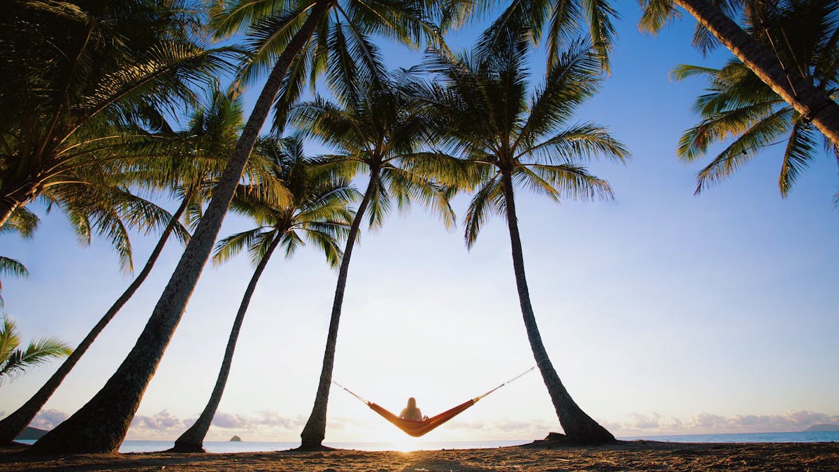 Sunrise hammock swinging at Palm Cove