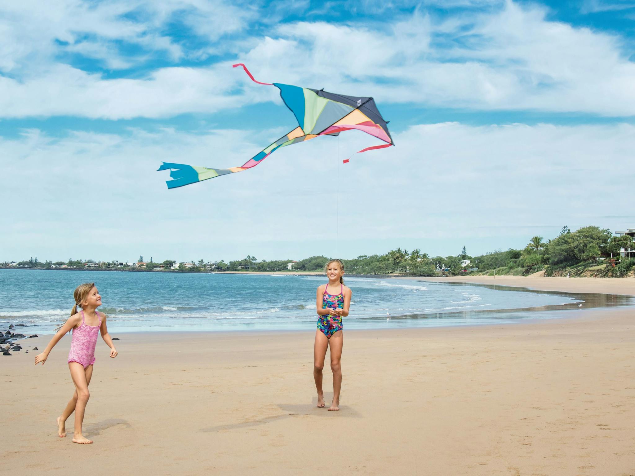Flying kites at Bargara Beach