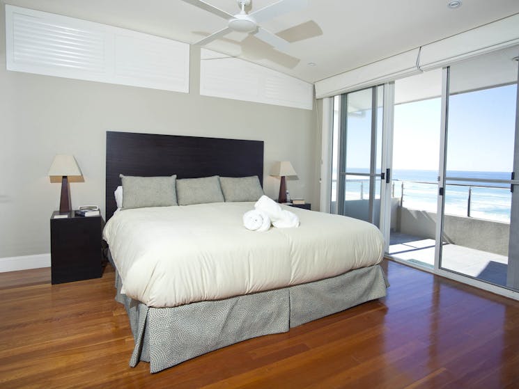 Azure's large master bedroom and private balcony overlook the beach.