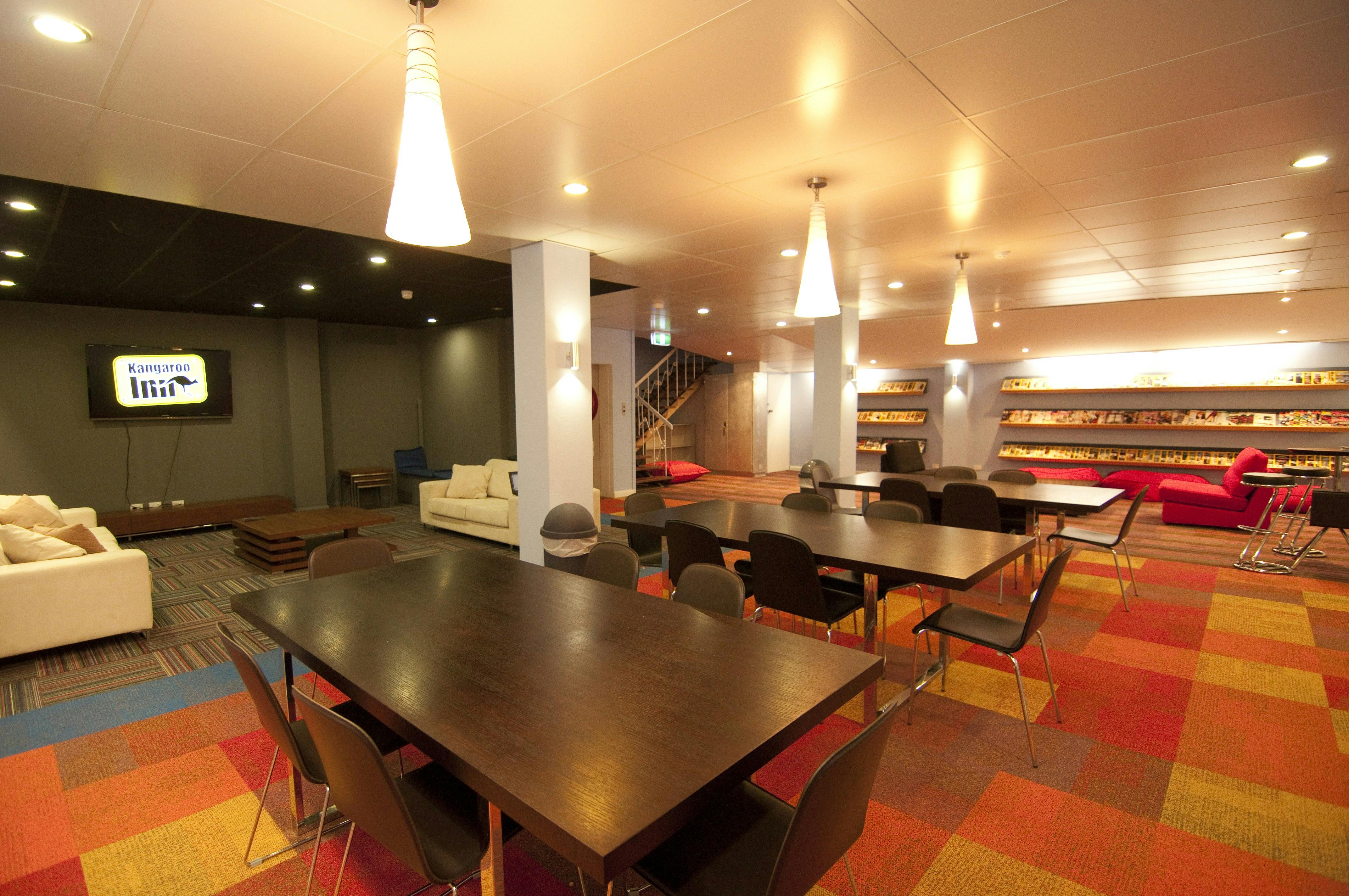 Basement Common Area - dining area in foreground, reading and home theatre areas in background