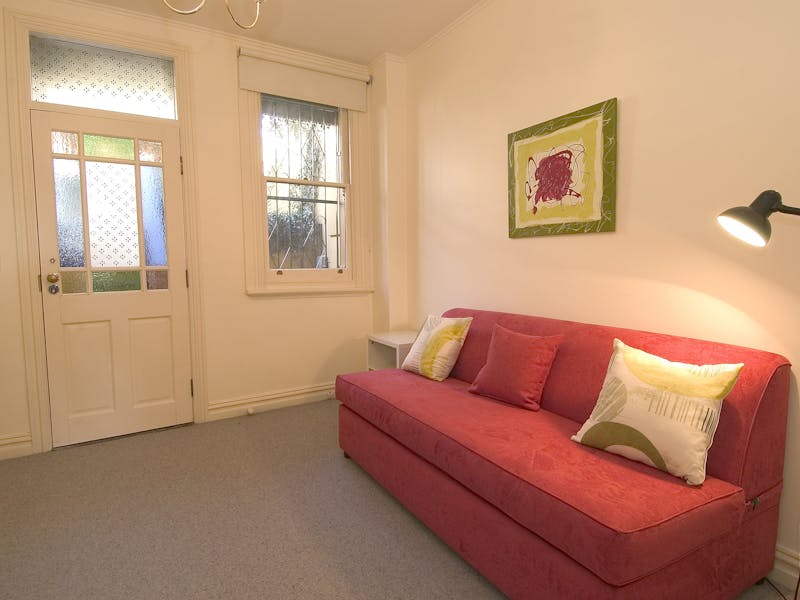 Lower unit living room with queen sofabed, digital television, DVD and CD player