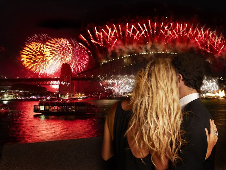 Couple watch fireworks from Sydney Opera House