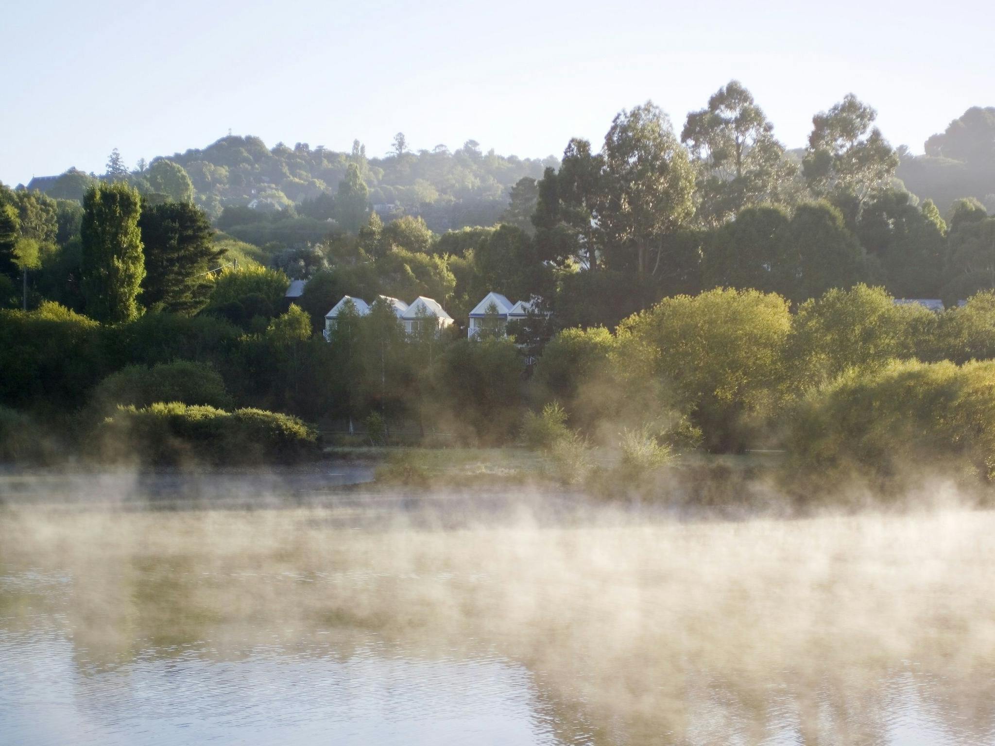 Lake House across the misty lake