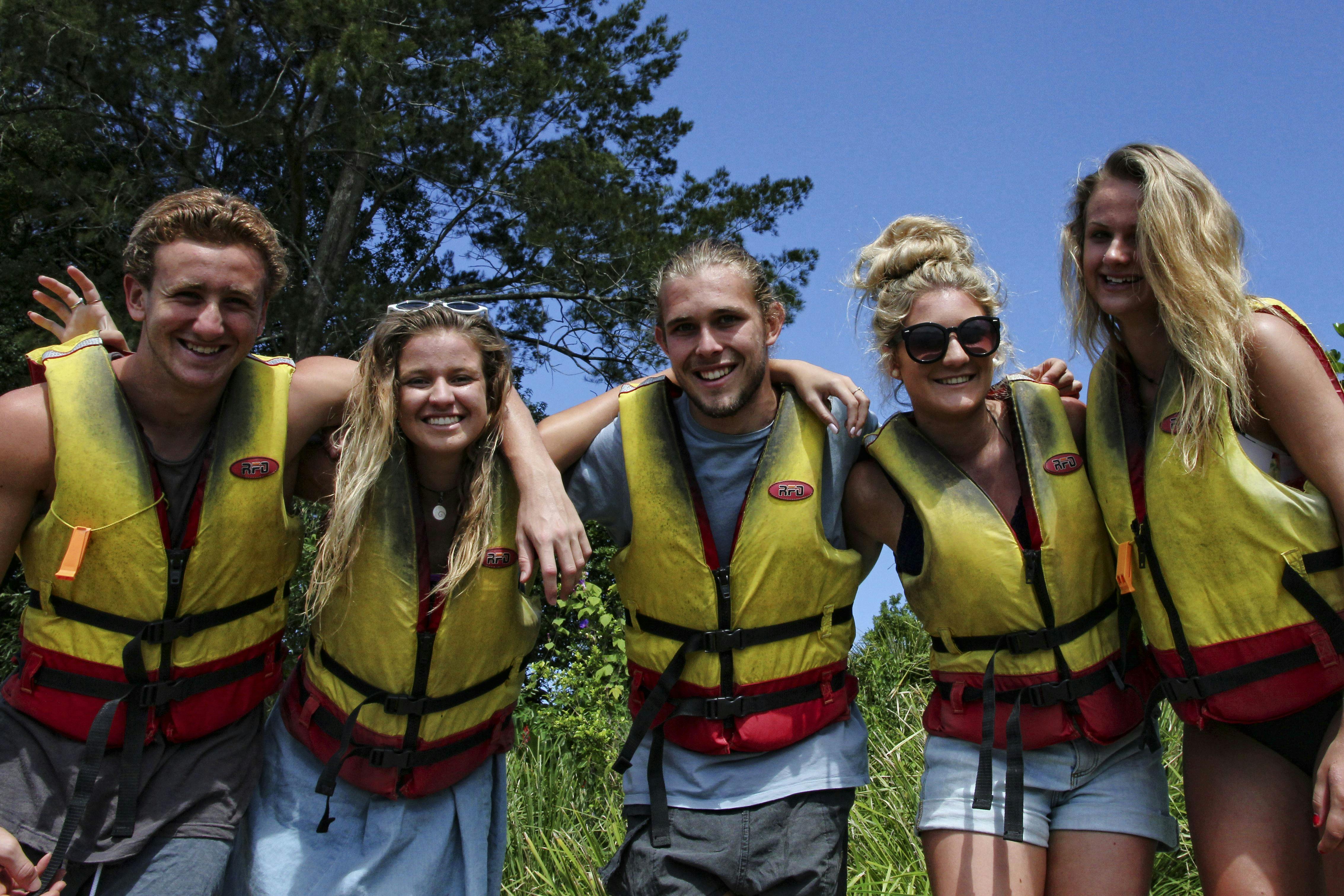 5 teenagers with life jackets on, ready to paddle withBellingen Canoe Adventures