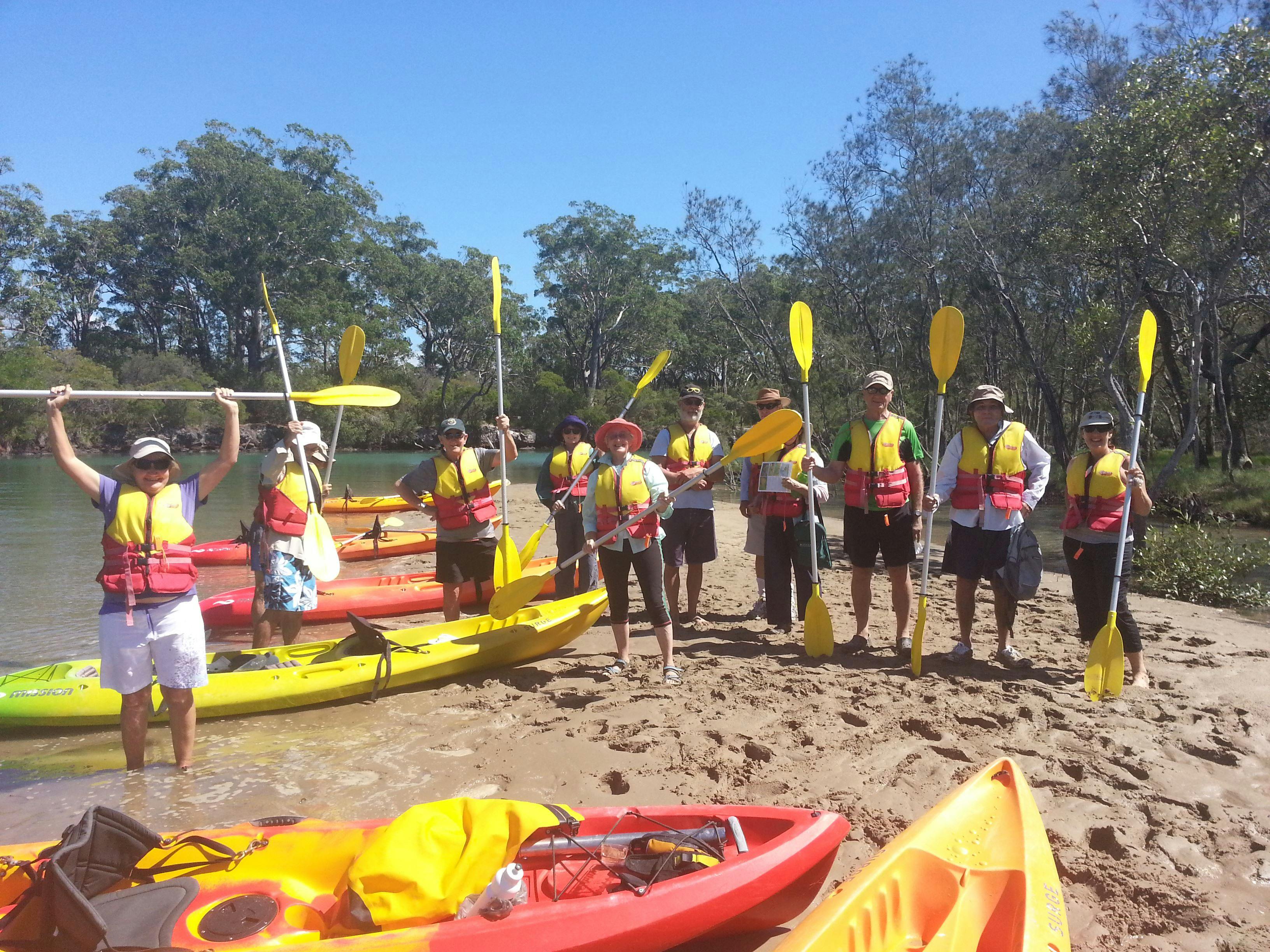 Relaxing on the shore after kayak leg with C-Change Adventures