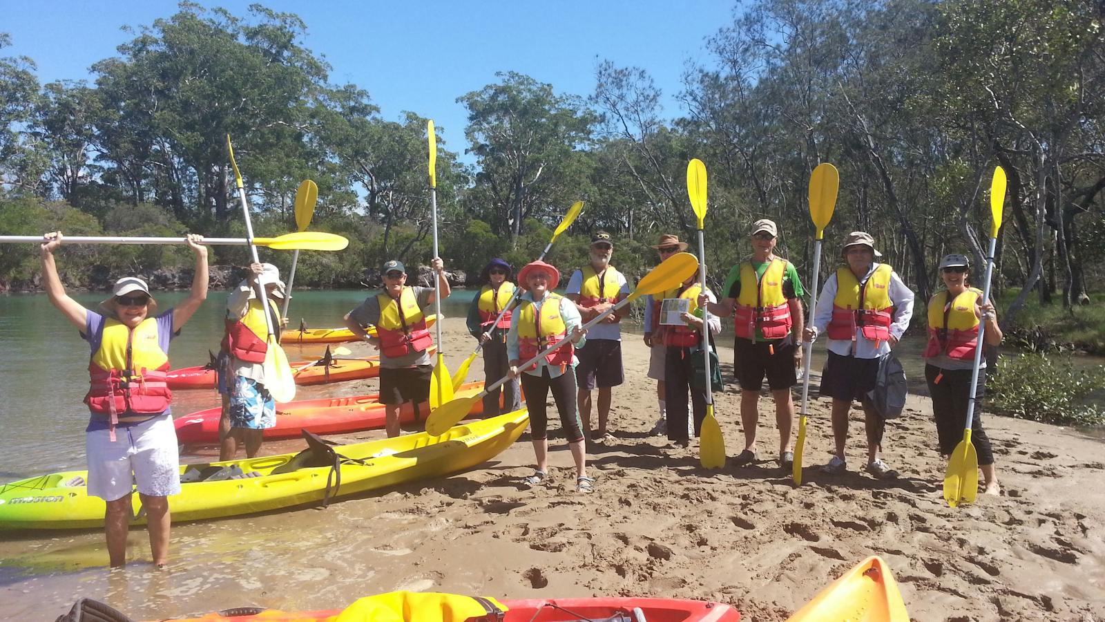Relaxing on the shore after kayak leg with C-Change Adventures