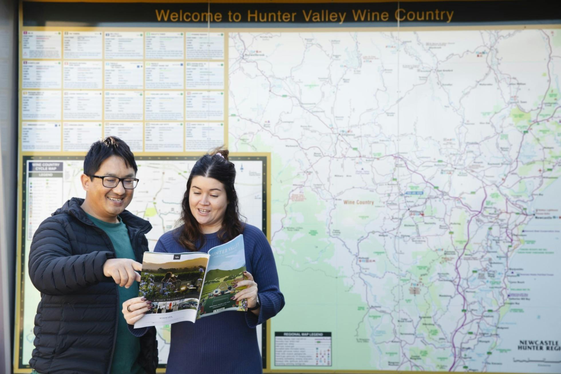 Visitors looking at Regional Guide in front of large outdoor map