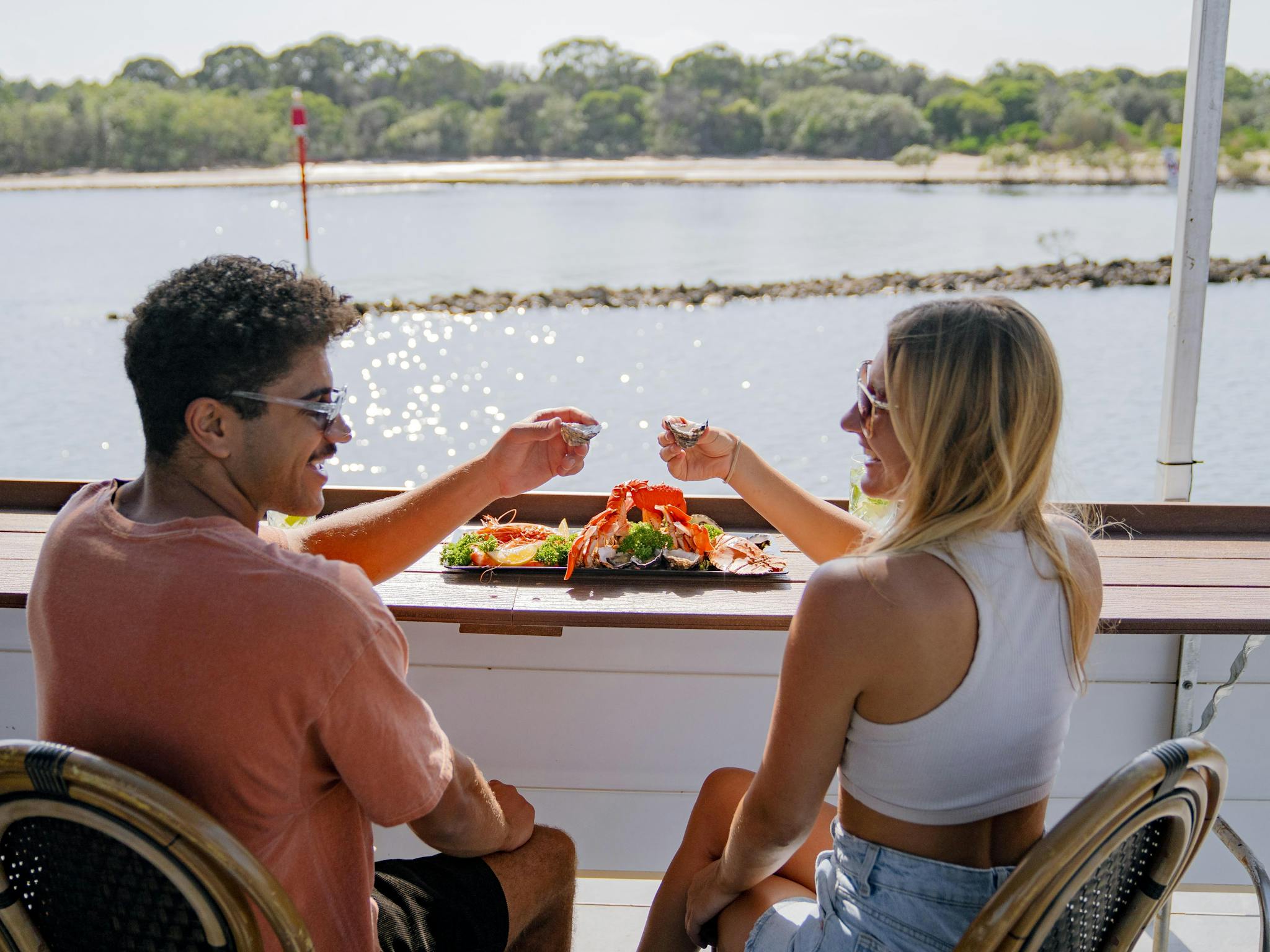 Couple with seafood platter.