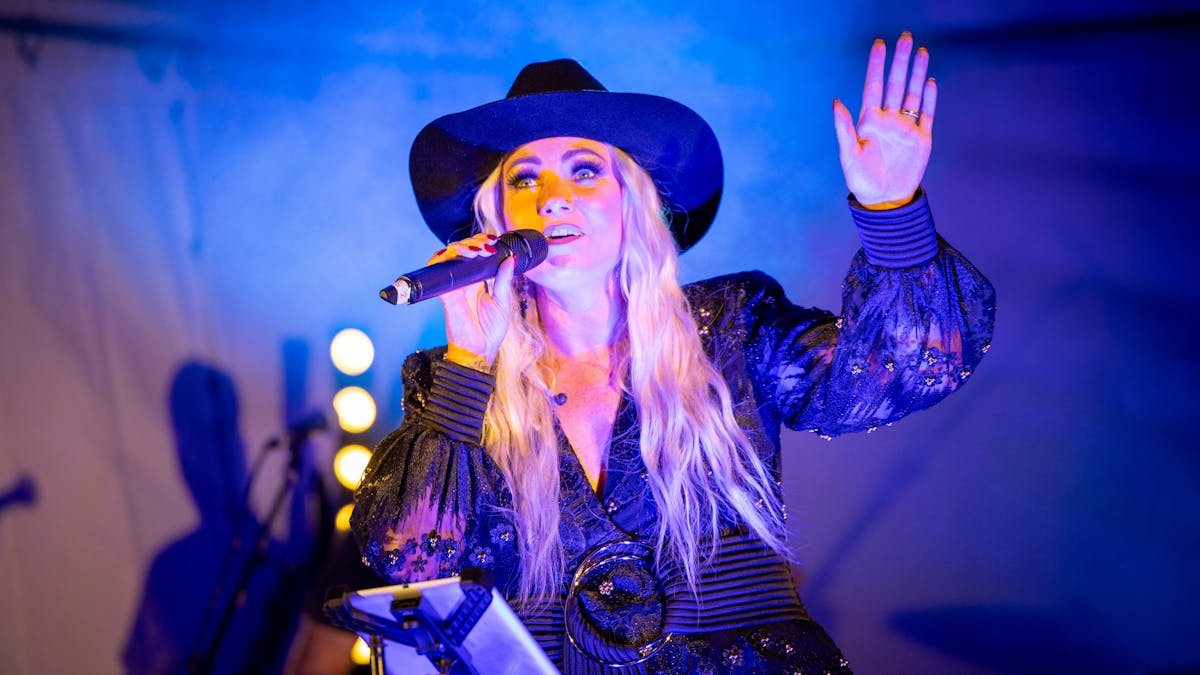 Singer Hayley Jenson performing on stage
