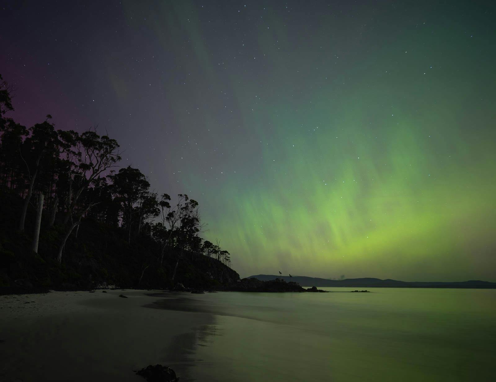 Colourful aurora above Tasmania's coastline