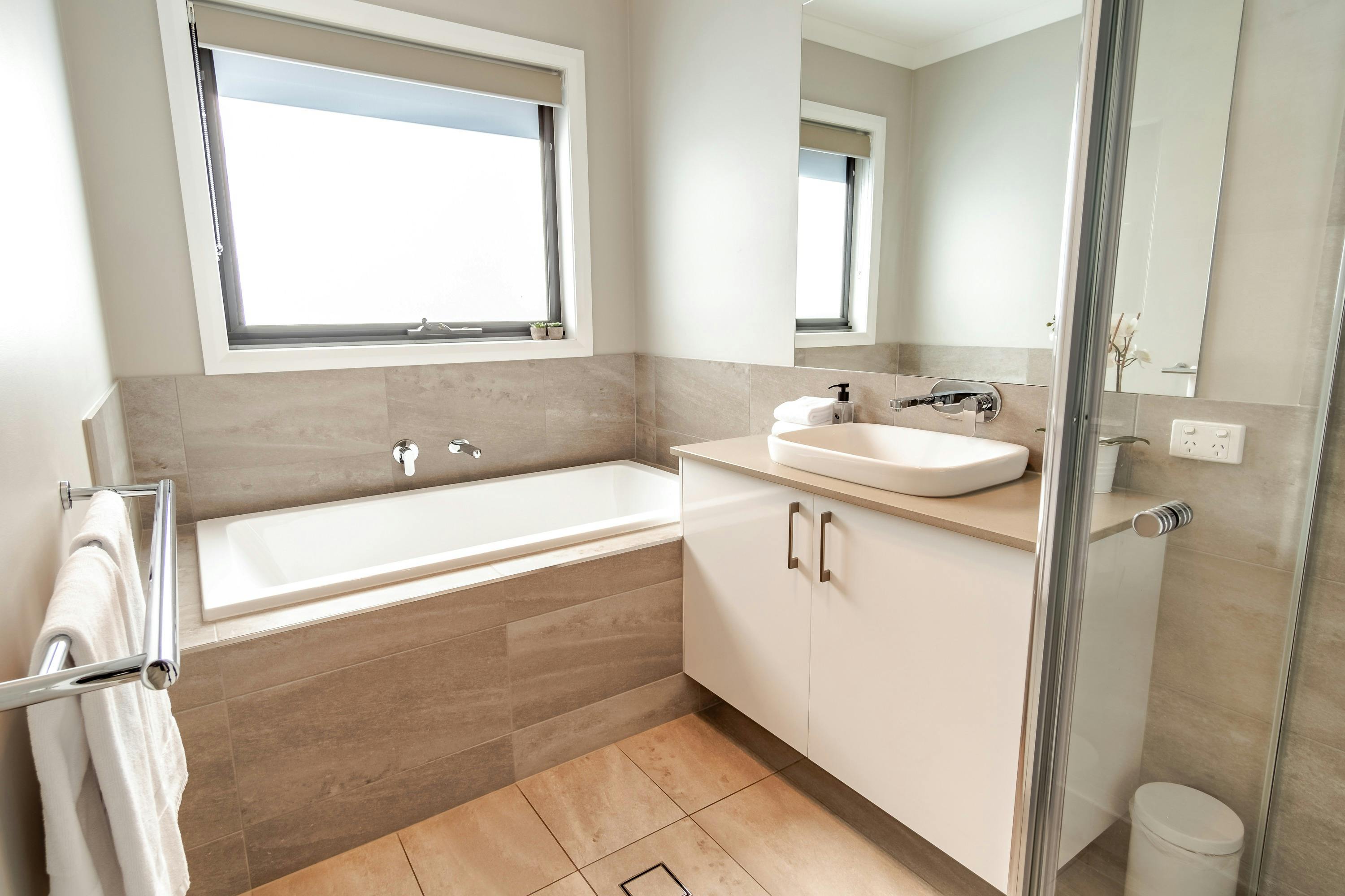 Bathroom with bathtub and shower