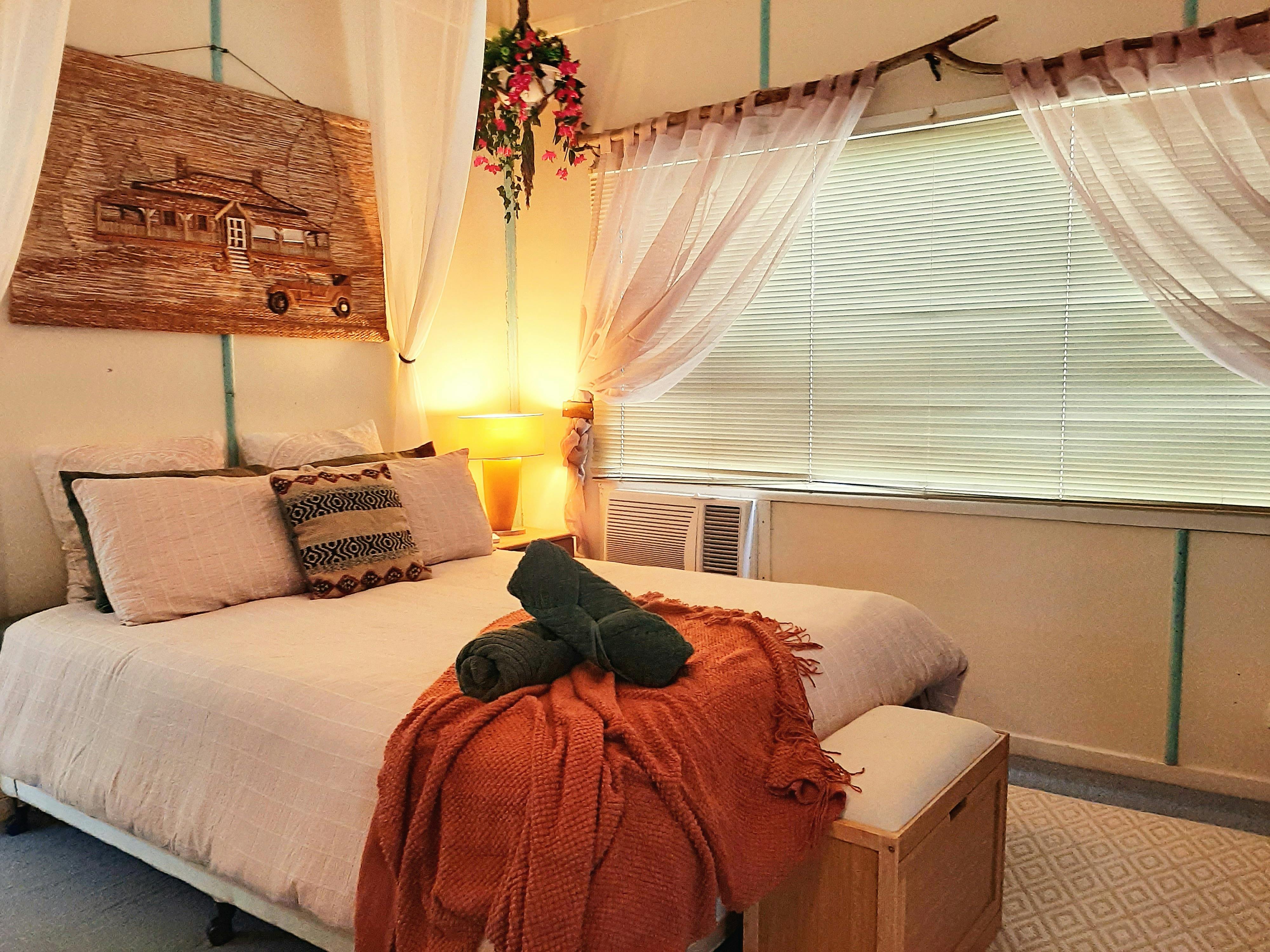 The Cardwellia Room features a comfortable queen bed and warm country-style charm