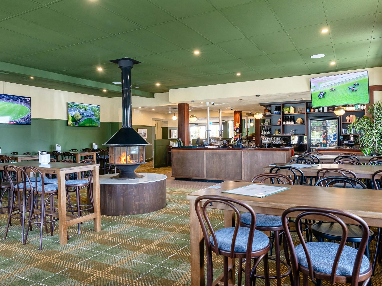 Main bar area, high tables, fireplace centre, open bar