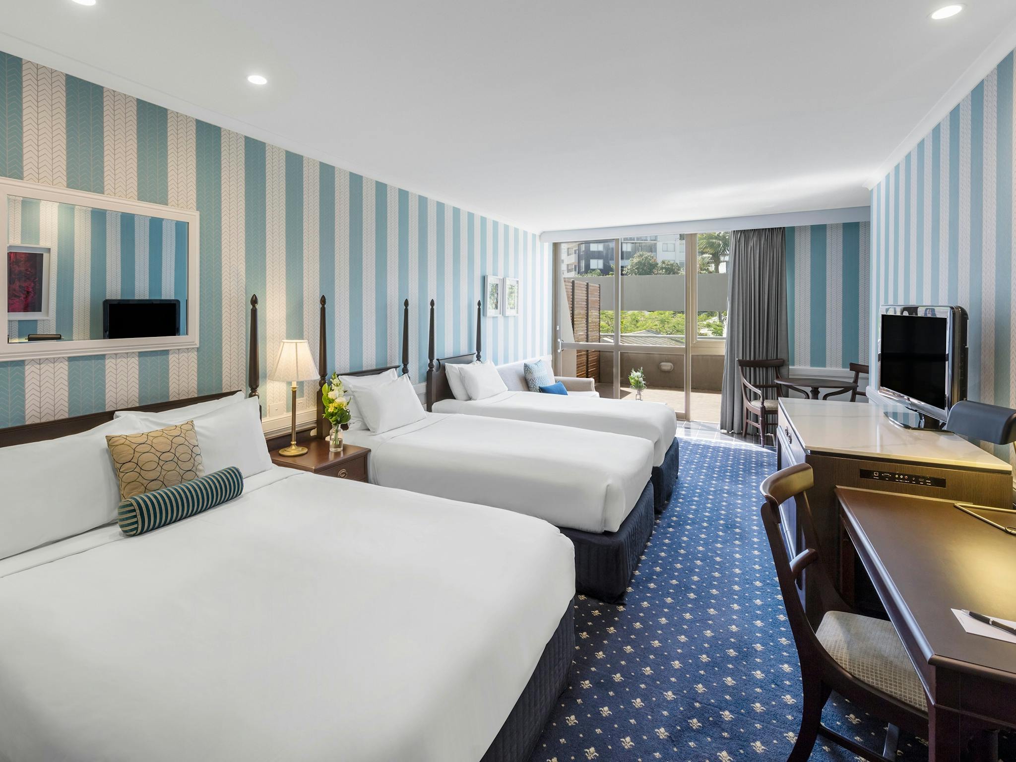 Hotel room with three double beds Hotel room with three double beds
