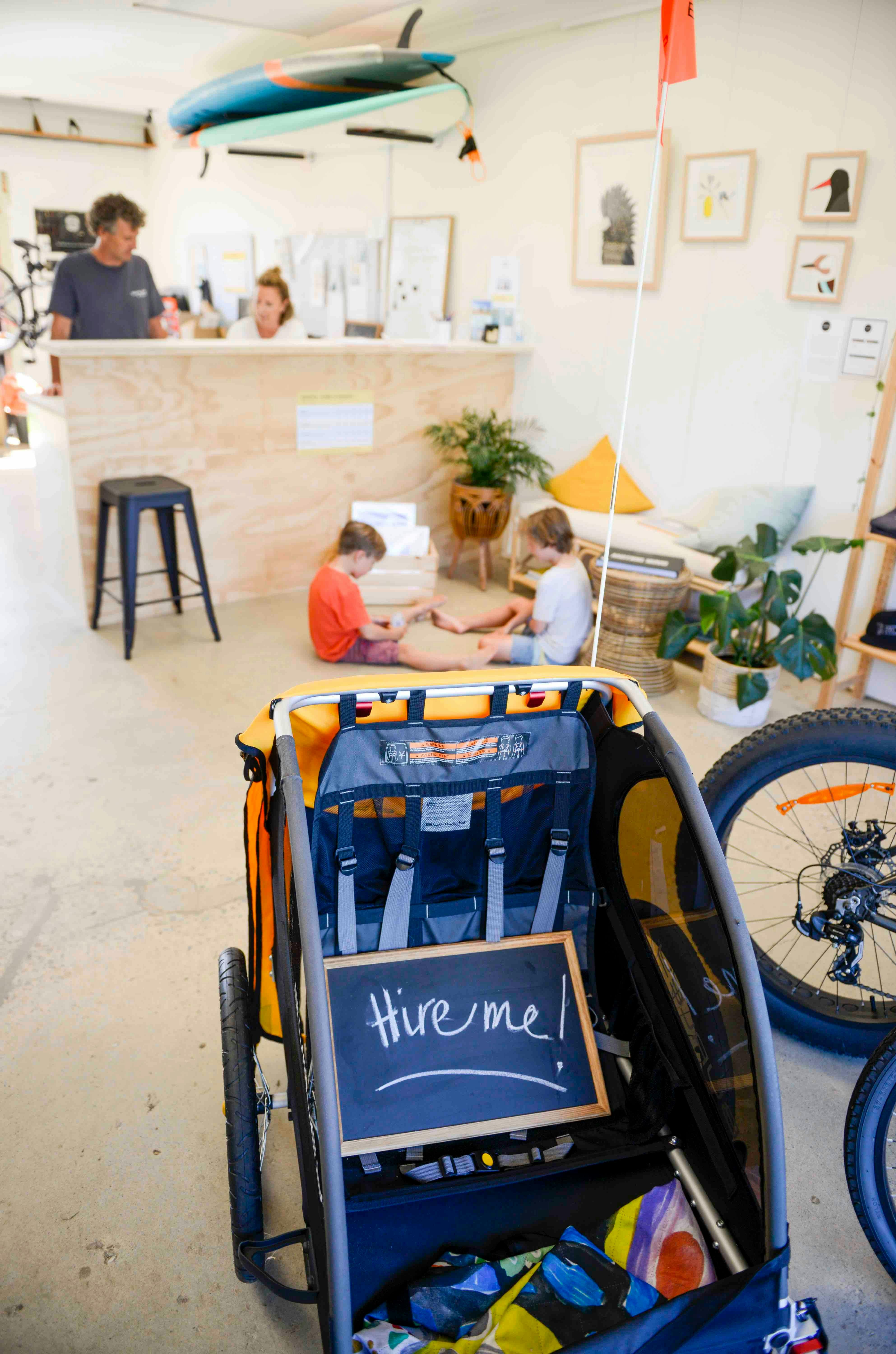 Hire shop floor with bikes and kids hire gear.