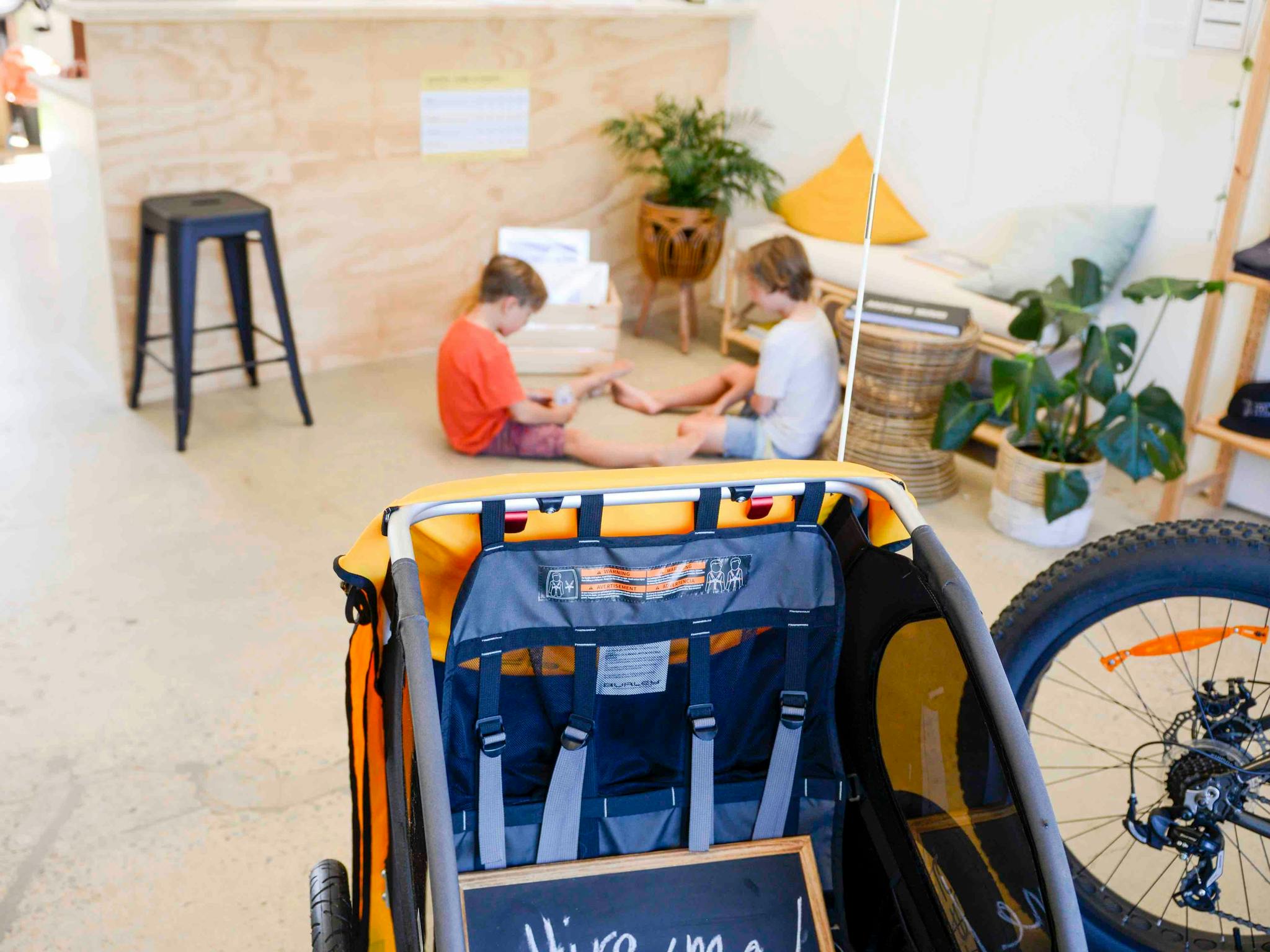 Hire shop floor with bikes and kids hire gear.