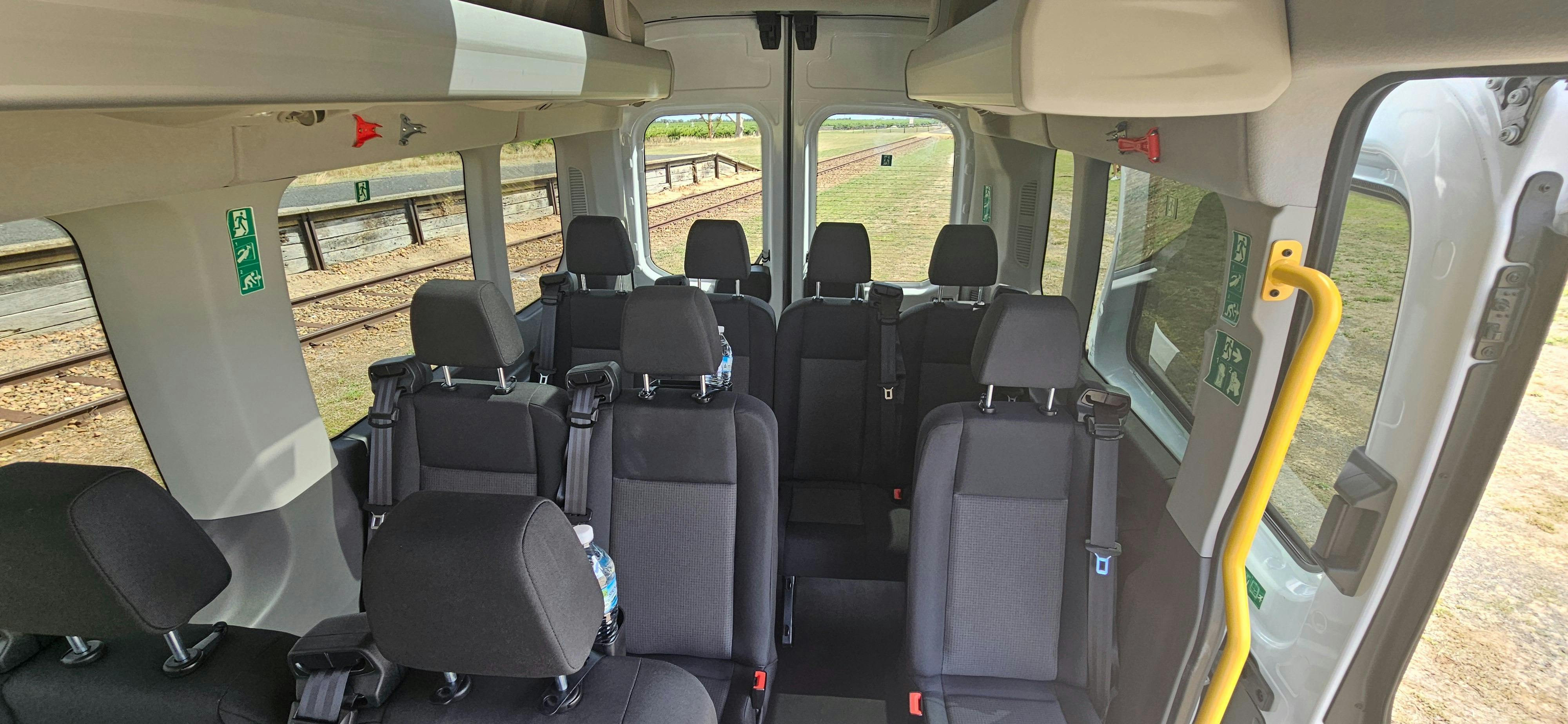 Comfortable interior seating inside our Ford Transit wine tour vehicle.