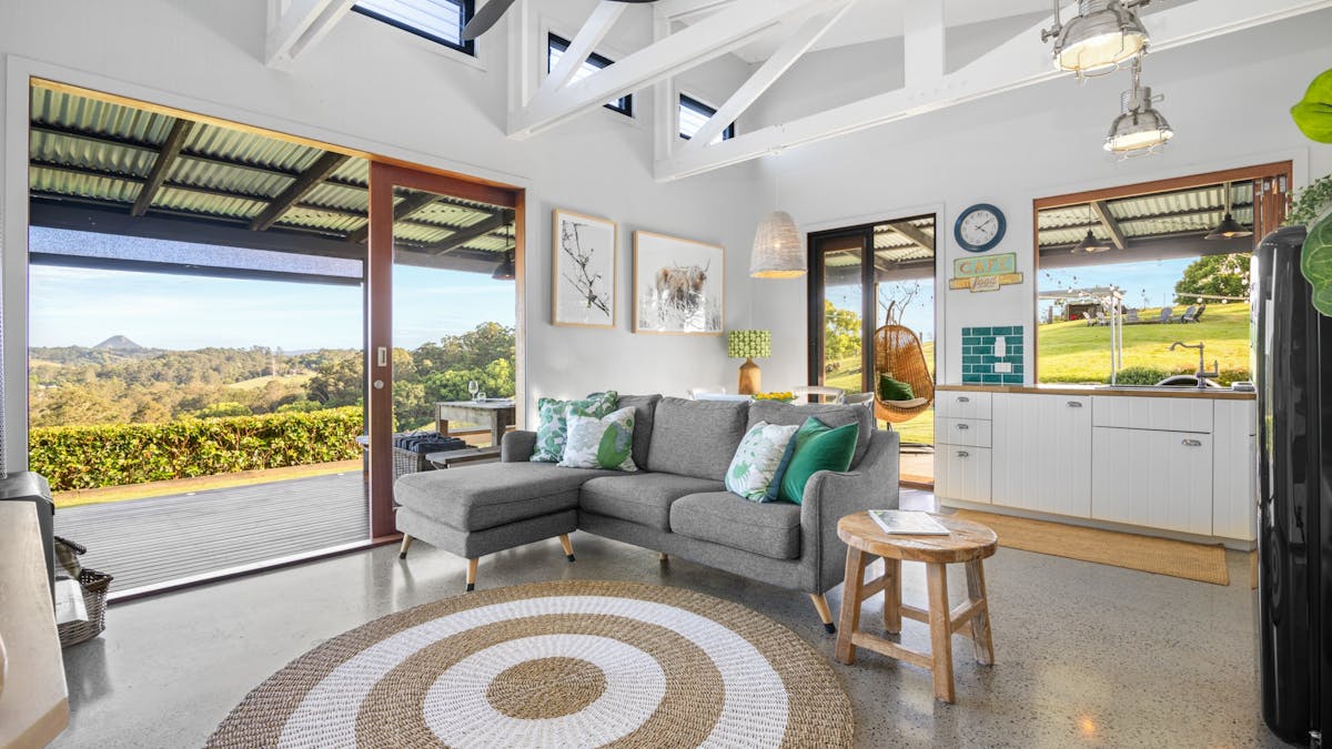 The spacious Barn living rea. High beamed ceilings with polished concrete floors throughout.