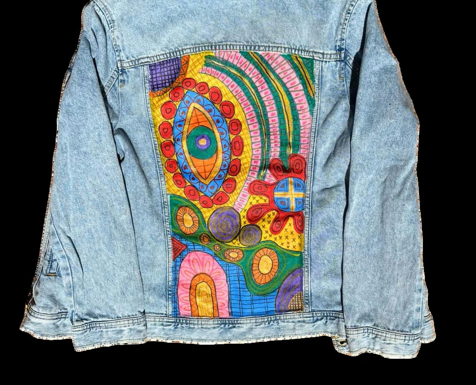 denim jacket with colourful picture painted on the back