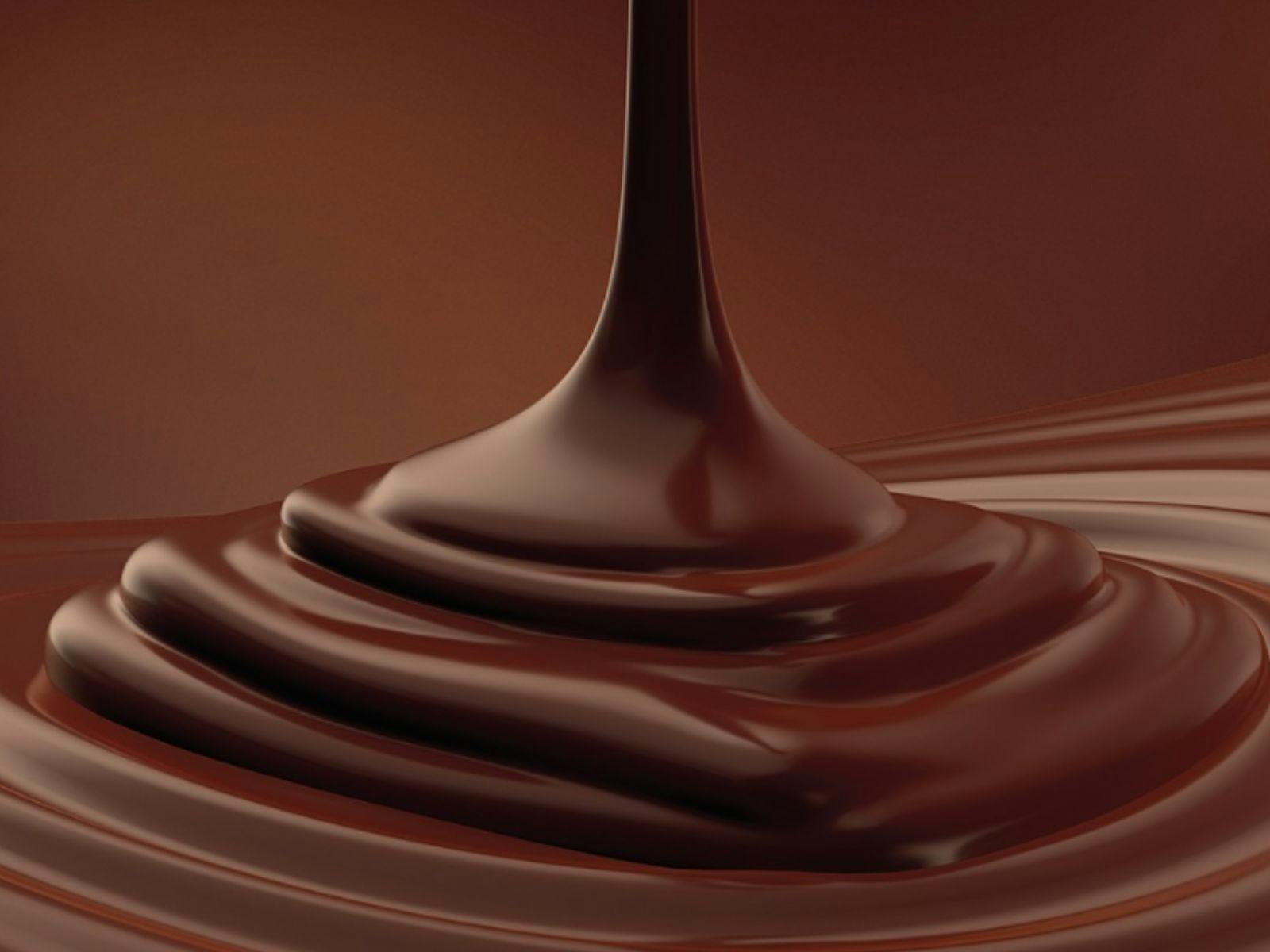 Closeup of melted semi-sweet chocolate, highlights the swirls and texture. Closeup of melted semi-sweet chocolate, highlights the swirls and texture.
