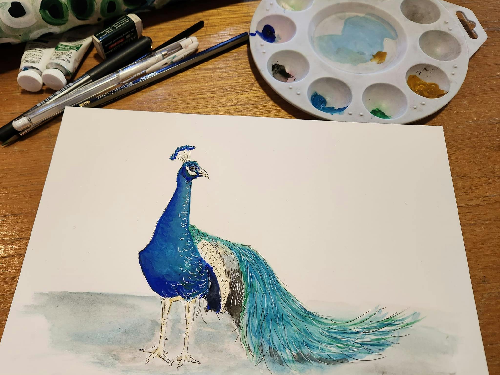 Painting of a peacock with palette and brushes