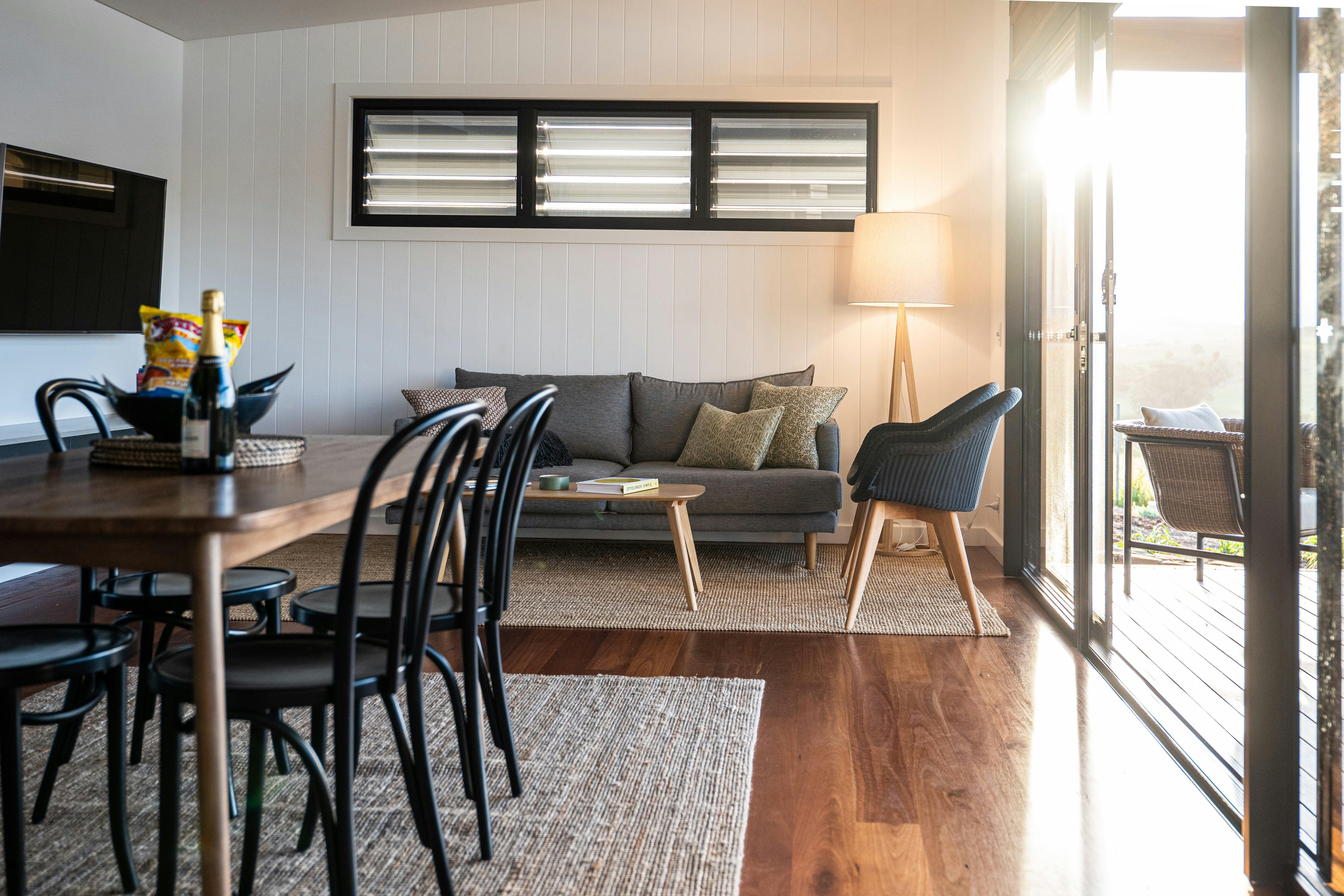 Open plan living, dining, and fully equipped kitchen.