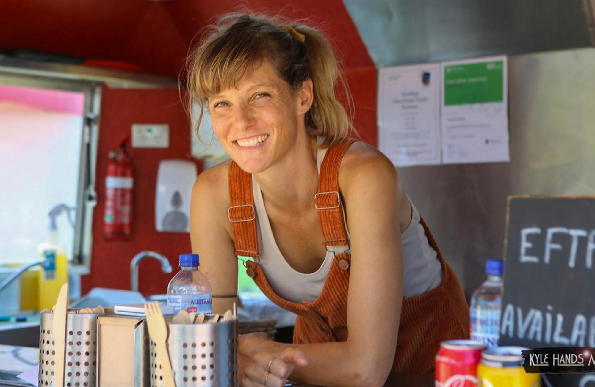 Stallholder smiling at market