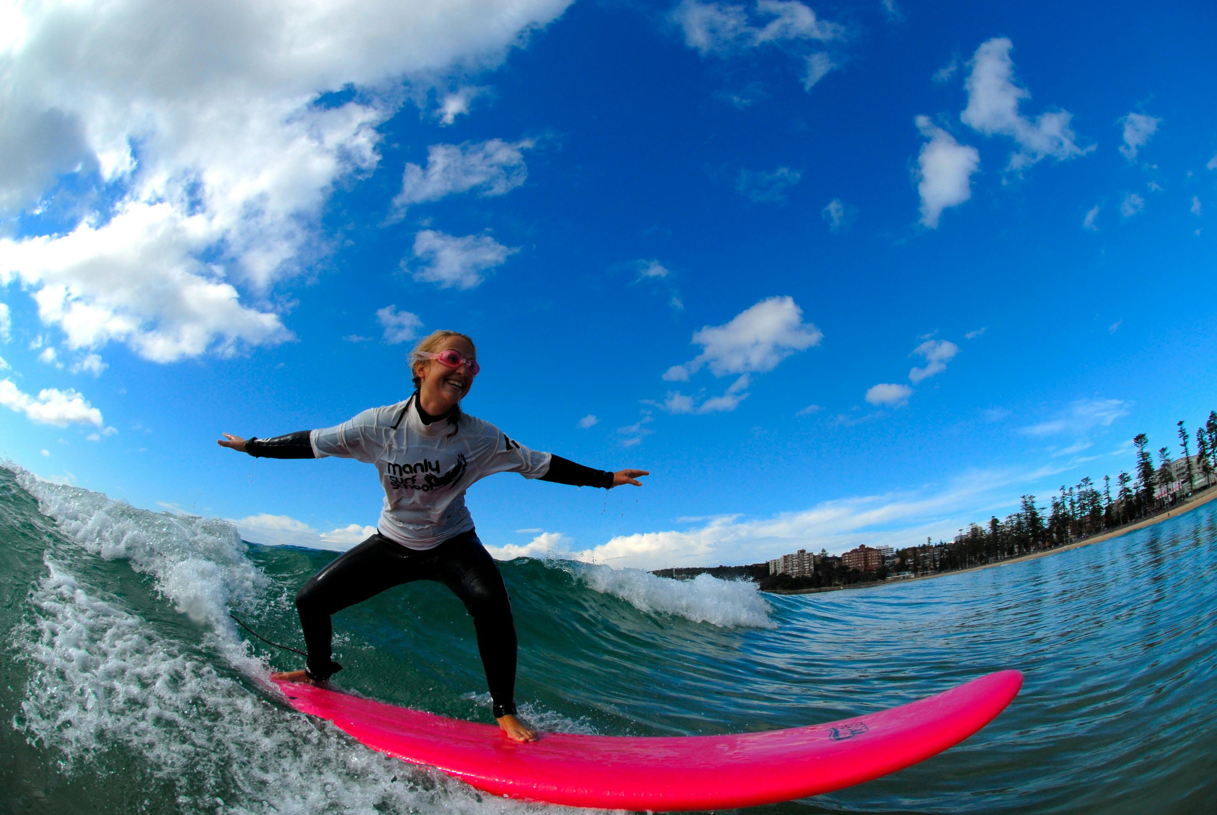 Beginner surfer at Manly Beach having the best time.
