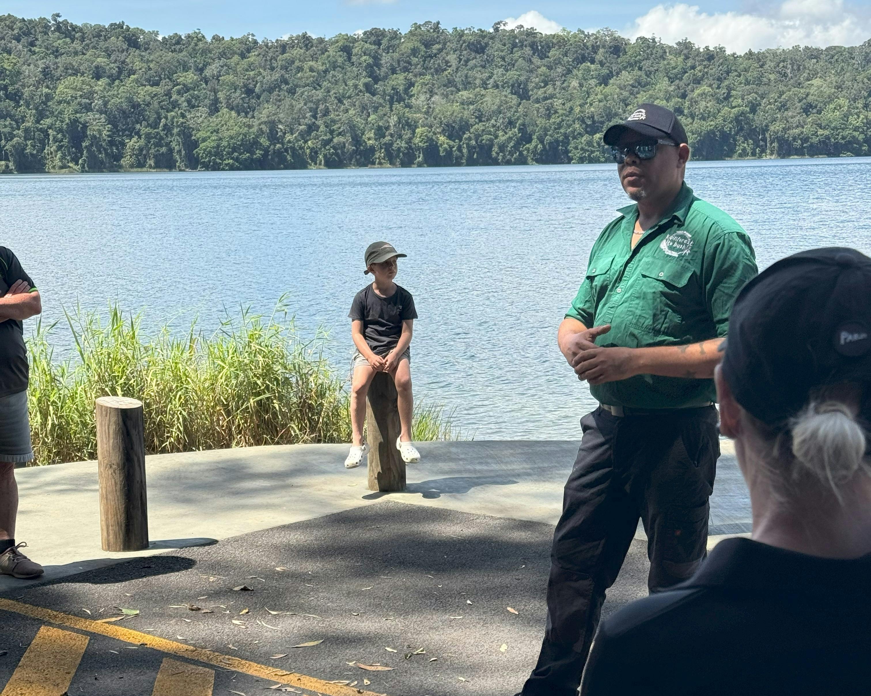 Guide talks to group at lake barrine