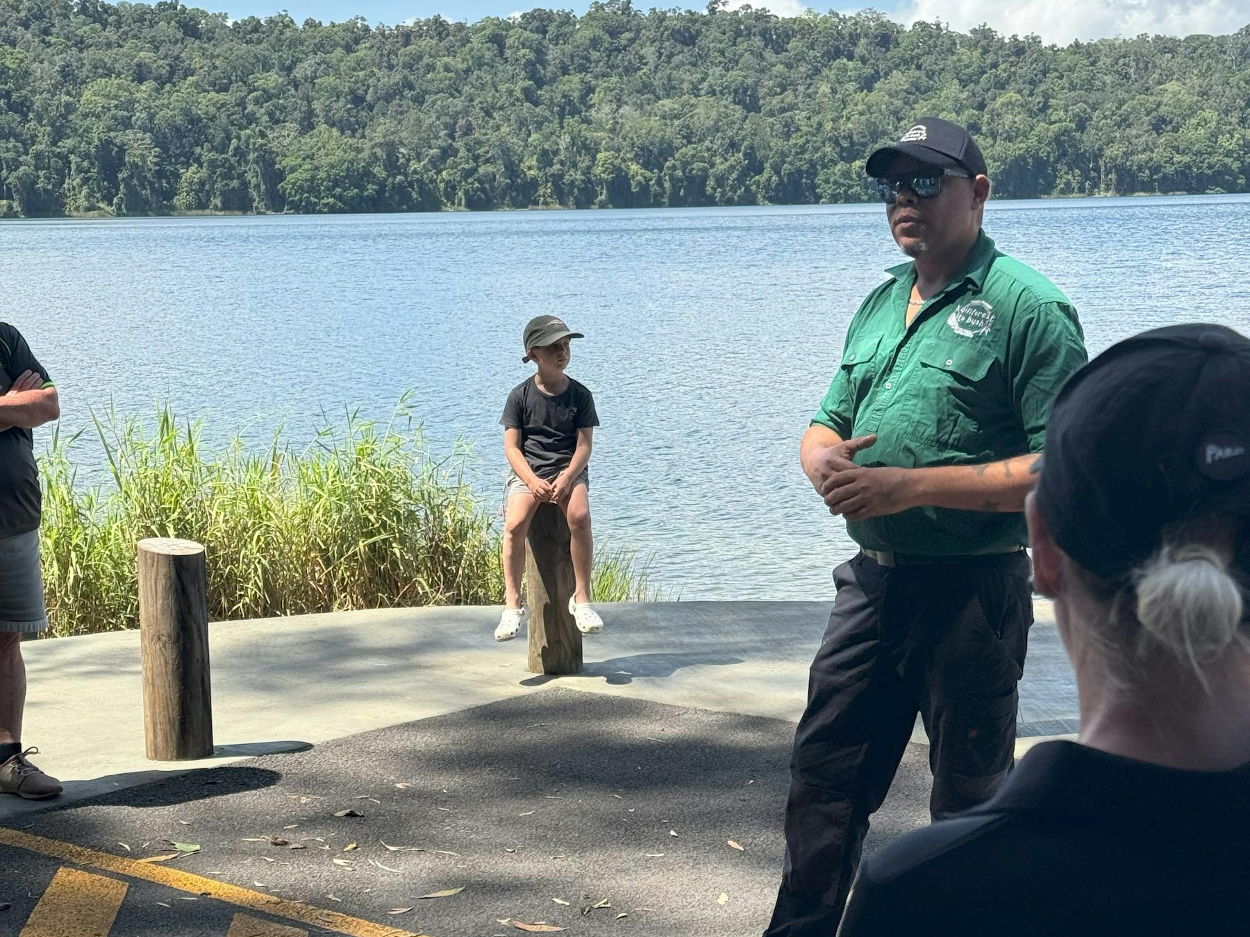 Guide talks to group at lake barrine