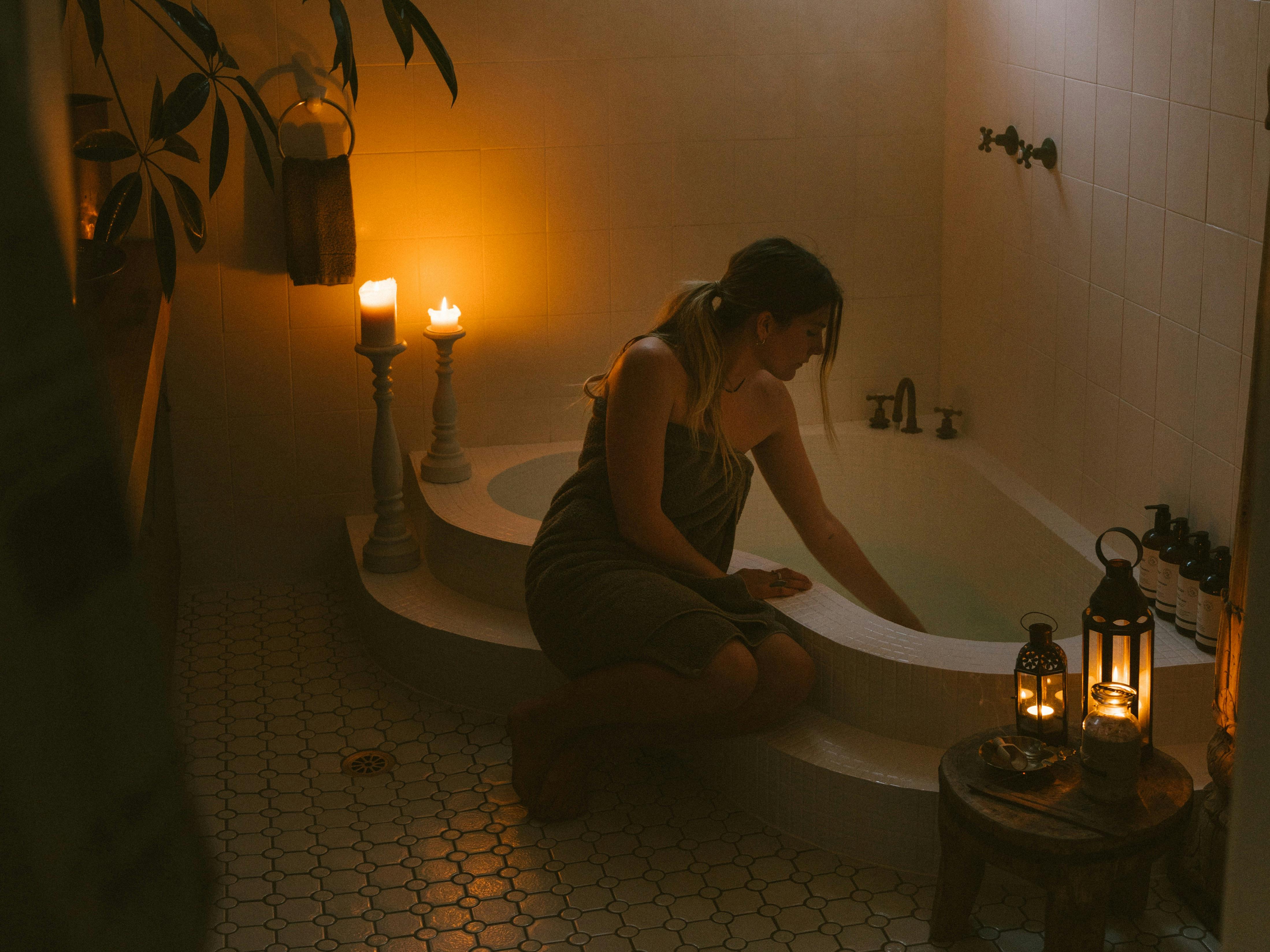 candle lit bathroom with a Moroccan style sunken bath