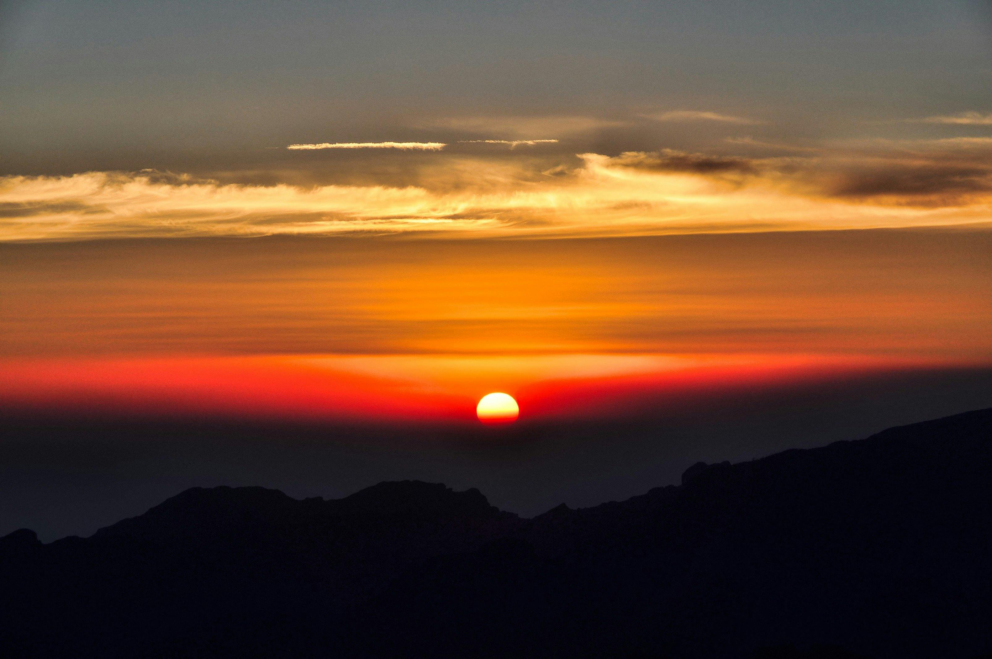 The sun setting in the distance on Mt Kilimanajro